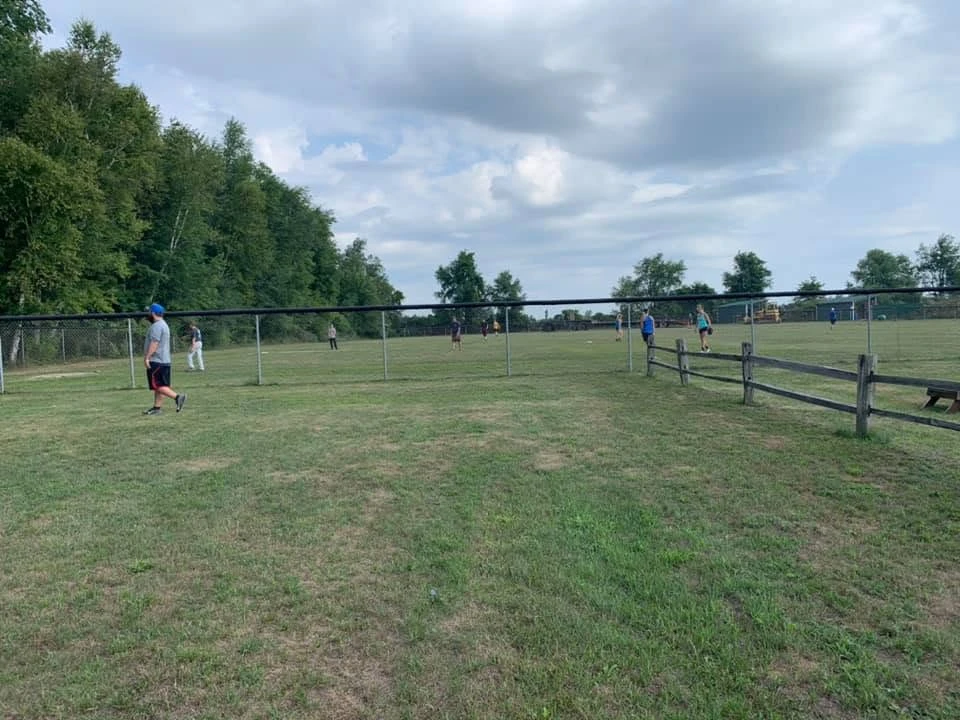 Members playing on the ball field