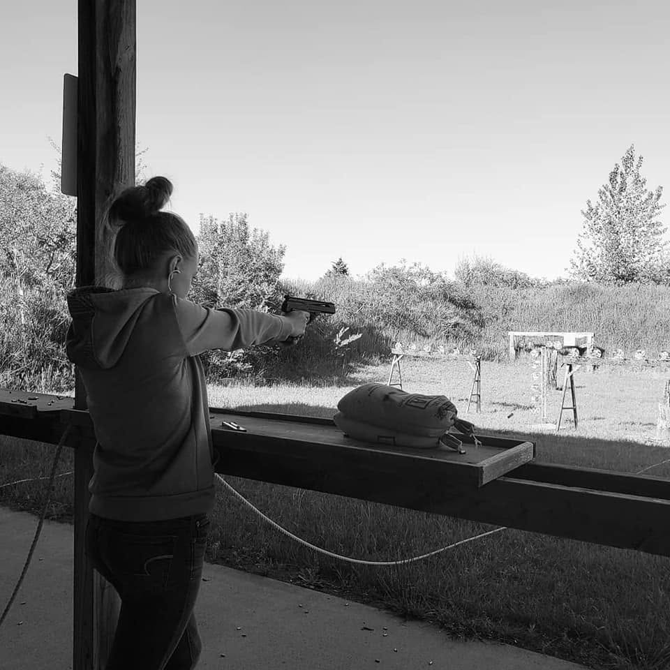 Member shooting pistol at the range