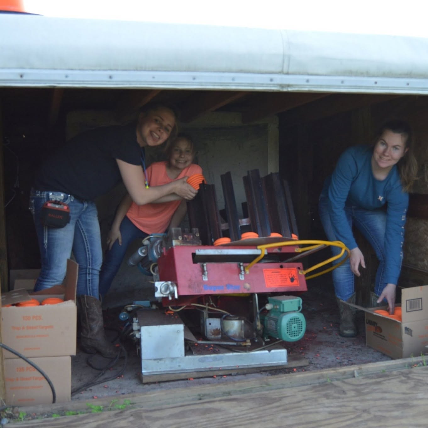 Members loading the trap machine